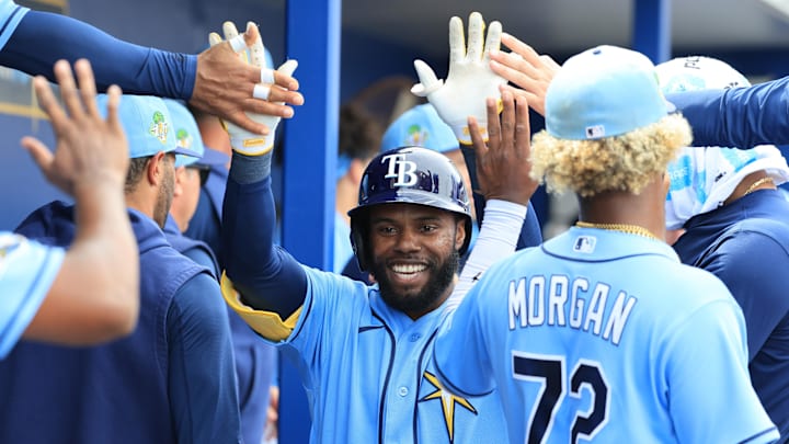 Feb 27, 2026; Port Charlotte, Florida, USA; Tampa Bay Rays center fielder Cedric Mullins (31) is congratulated after he hit a solo home run during the third inning against the Toronto Blue Jays at Charlotte Sports Park. Mandatory Credit: Kim Klement Neitzel-Imagn Images