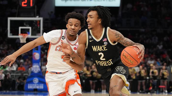 Mar 11, 2026; Charlotte, NC, USA; Wake Forest Demon Deacons forward Juke Harris (2) with the ball as Clemson Tigers guard Efrem Johnson (4) defends in the first half at Spectrum Center. Mandatory Credit: Bob Donnan-Imagn Images
