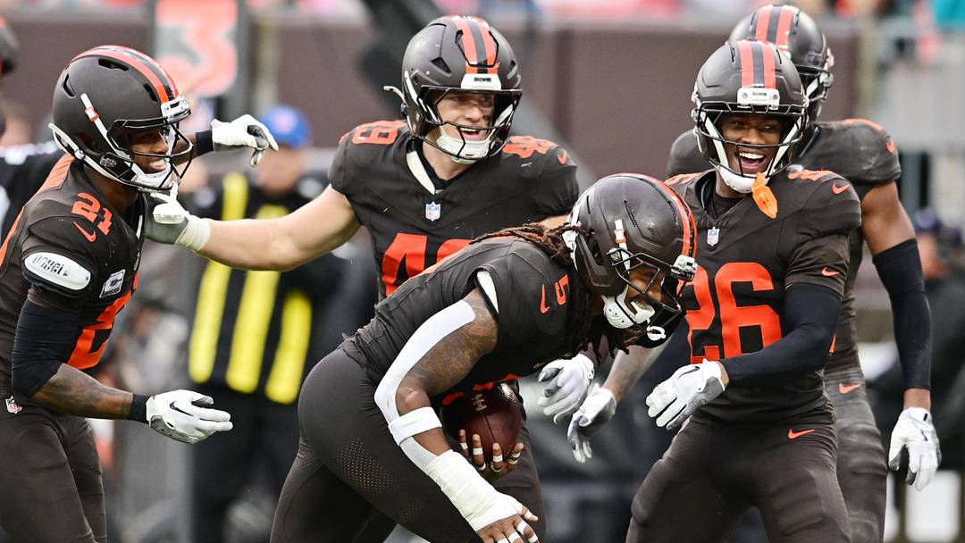 Oct 19, 2025; Cleveland, Ohio, USA; Cleveland Browns safety Rayshawn Jenkins (5) celebrates with cornerback Denzel Ward (21) and linebacker Carson Schwesinger (49) and cornerback Myles Harden (26) after an interception during the second half against the Miami Dolphins at Huntington Bank Field. Mandatory Credit: Ken Blaze-Imagn Images