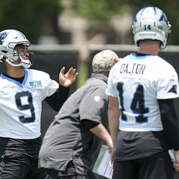 Jun 11, 2025; Charlotte, NC, USA;  Carolina Panthers quarterback Andy Dalton (14) watches quarterback Bryce Young (9) throw during minicamp at Bank of America Stadium. Mandatory Credit: Jim Dedmon-Imagn Images