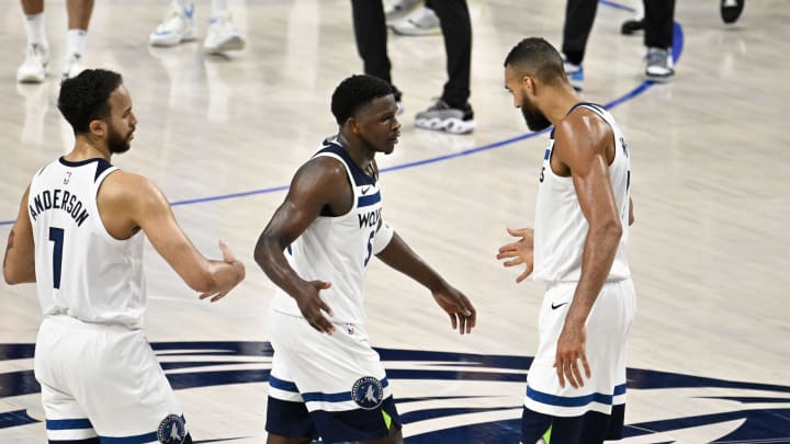 Minnesota Timberwolves forward Kyle Anderson (1) and guard Anthony Edwards (5) and center Rudy Gobert (27) during the second half against the Dallas Mavericks in Game 4 of the Western Conference finals at American Airlines Center in Dallas on May 28, 2024. 