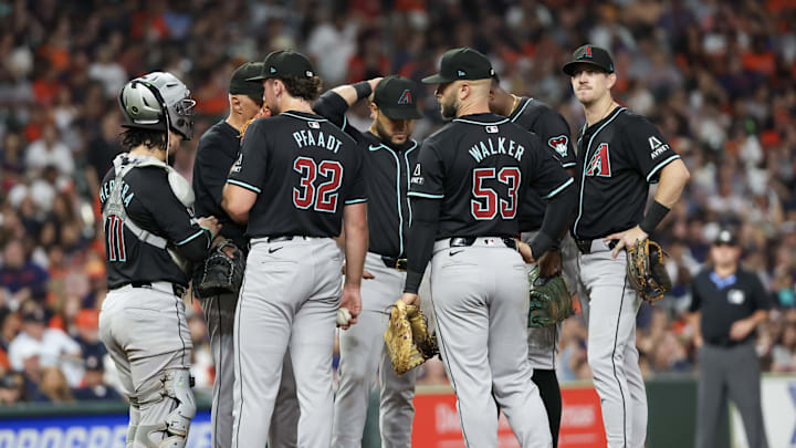 Sep 6, 2024; Houston, Texas, USA;   Arizona Diamondbacks starting pitcher Brandon Pfaadt (32) gets a visit from a pitching coach between pitches against the Houston Astros  in the third inning at Minute Maid Park. Mandatory Credit: Thomas Shea-Imagn Images