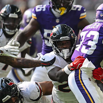 Aug 9, 2025; Minneapolis, Minnesota, USA; Houston Texans cornerback Myles Bryant (27) tackles Minnesota Vikings wide receiver Silas Bolden (83) during the fourth quarter at U.S. Bank Stadium. Mandatory Credit: Jeffrey Becker-Imagn Images