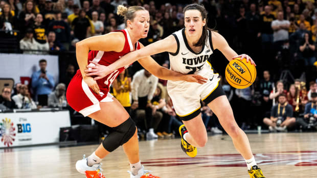 Iowa guard Caitlin Clark (22) drives to the basket against Nebraska guard Callin Hake during the Big Ten Tournament champions