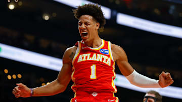 Jalen Johnson reacting emphatically after dunking the ball against the Toronto Raptors