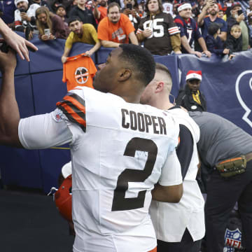Dec 24, 2023; Houston, Texas, USA; Cleveland Browns wide receiver Amari Cooper (2) signs autographs for fans after the game against the Houston Texans at NRG Stadium. Mandatory Credit: Troy Taormina-USA TODAY Sports
