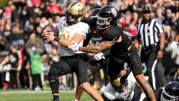 UCF's quarterback John Rhys Plumlee (10) gets taken down by UC's defense during the UC vs. UCF game at Nippert Stadium on Saturday, November 4, 2023. UCF leads the game at halftime with a score of 14-10.