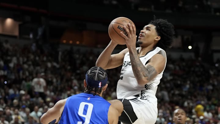Jul 12, 2025; Las Vegas, NV, USA; San Antonio Spurs guard Dylan Harper (2) shoots against Dallas Mavericks guard Ryan Nembhard (9) in the first quarter of their game at Thomas & Mack Center. Mandatory Credit: Candice Ward-Imagn Images Jul 12, 2025; Las Vegas, NV, USA; San Antonio Spurs guard Dylan Harper (2) shoots against Dallas Mavericks guard Ryan Nembhard (9) in the first quarter of their game at Thomas & Mack Center. Mandatory Credit: Candice Ward-Imagn Images
