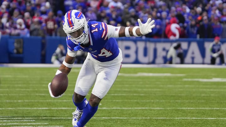 Dec 31, 2023; Orchard Park, New York, USA; Buffalo Bills wide receiver Stefon Diggs (14) runs with the ball along the sidelines after making a catch against the New England Patriots during the second half at Highmark Stadium. Mandatory Credit: Gregory Fisher-USA TODAY Sports