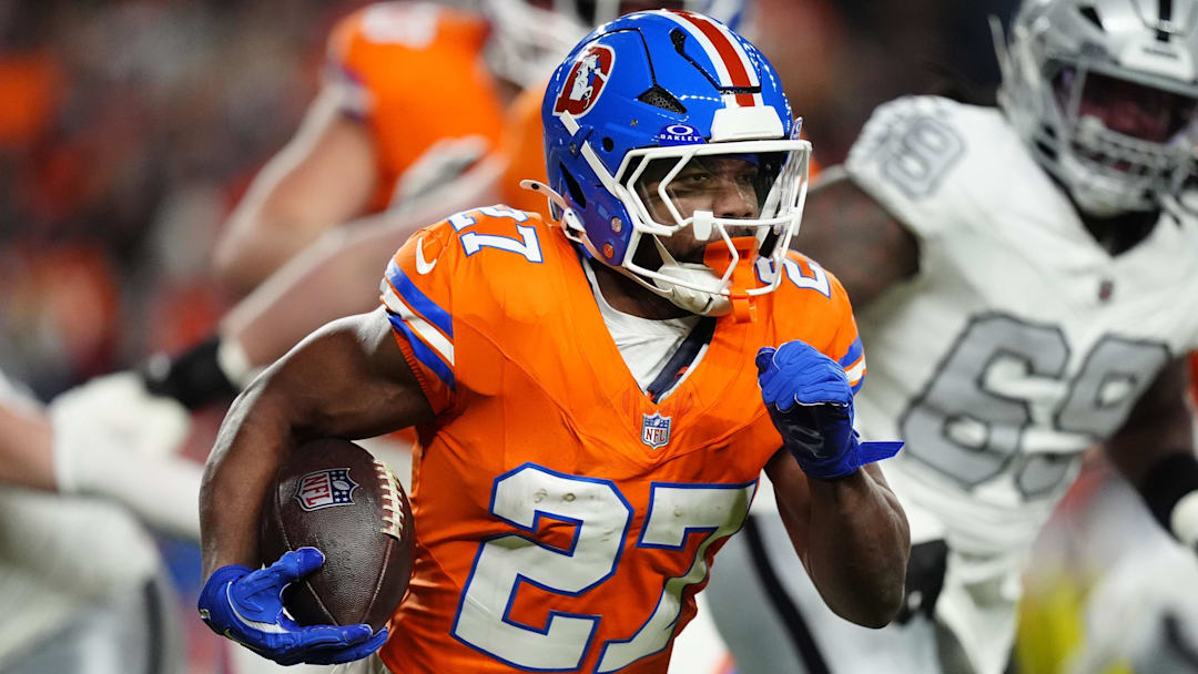 Nov 6, 2025; Denver, Colorado, USA; Denver Broncos running back J.K. Dobbins (27) rushes the ball against the Las Vegas Raiders during the first half at Empower Field at Mile High. Mandatory Credit: Ron Chenoy-Imagn Images