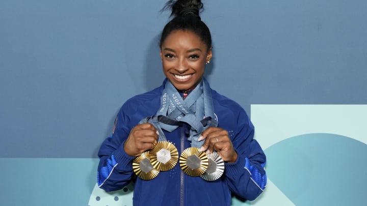 Aug 5, 2024: Simone Biles of the United States poses for a photo with her three gold and one silver medal after day three of the gymnastics event finals during the Paris 2024 Olympic Summer Games.