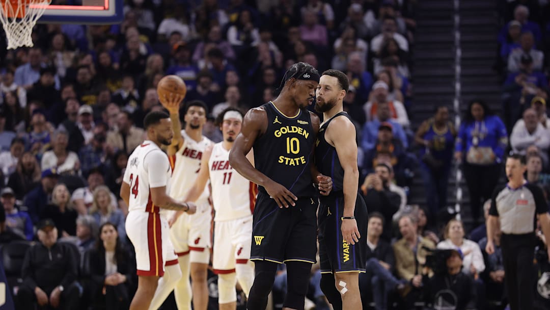 Jan 19, 2026; San Francisco, California, USA; Golden State Warriors forward Jimmy Butler III (10) and guard Stephen Curry (30) react after Butler misses a shot at the buzzer during the first quarter against the Miami Heat at Chase Center. Mandatory Credit: Kelley L Cox-Imagn Images