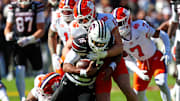 Nov 29, 2025; Columbia, South Carolina, USA; South Carolina Gamecocks quarterback Lanorris Sellers (16) is stopped for a loss by Clemson Tigers defensive end Will Heldt (13) in the first quarter at Williams-Brice Stadium. Mandatory Credit: Jeff Blake-Imagn Images