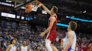 Mar 29, 2025; Newark, NJ, USA; Alabama Crimson Tide forward Grant Nelson (4) dunks the ball against Duke Blue Devils guard Kon Knueppel (7) during the first half in the East Regional final of the 2025 NCAA tournament at Prudential Center. Mandatory Credit: Robert Deutsch-Imagn Images