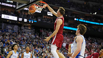 Mar 29, 2025; Newark, NJ, USA; Alabama Crimson Tide forward Grant Nelson (4) dunks the ball against Duke Blue Devils guard Kon Knueppel (7) during the first half in the East Regional final of the 2025 NCAA tournament at Prudential Center. Mandatory Credit: Robert Deutsch-Imagn Images