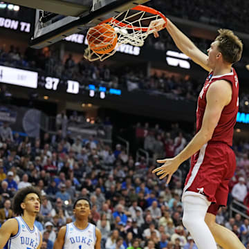 Mar 29, 2025; Newark, NJ, USA; Alabama Crimson Tide forward Grant Nelson (4) dunks the ball against Duke Blue Devils guard Kon Knueppel (7) during the first half in the East Regional final of the 2025 NCAA tournament at Prudential Center. Mandatory Credit: Robert Deutsch-Imagn Images