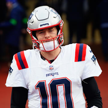 Dec 31, 2023; Orchard Park, New York, USA; New England Patriots quarterback Mac Jones (10) walks out to the field prior to the game against the Buffalo Bills at Highmark Stadium.