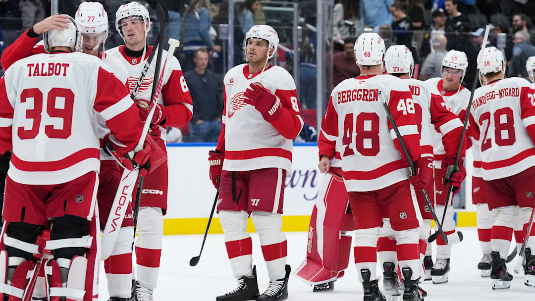 Oct 2, 2025; Toronto, Ontario, CAN; Detroit Red Wings defenseman Simon Edvinsson (77) celebrates the win with goaltender Cam Talbot (39) against the Toronto Maple Leafs at the end of the third period at Scotiabank Arena. Mandatory Credit: Nick Turchiaro-Imagn Images
