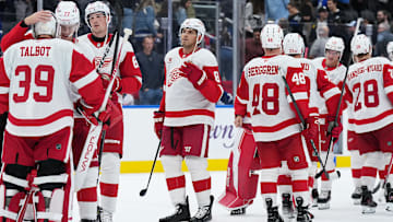 Oct 2, 2025; Toronto, Ontario, CAN; Detroit Red Wings defenseman Simon Edvinsson (77) celebrates the win with goaltender Cam Talbot (39) against the Toronto Maple Leafs at the end of the third period at Scotiabank Arena. Mandatory Credit: Nick Turchiaro-Imagn Images