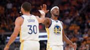 Apr 15, 2025; San Francisco, California, USA; Golden State Warriors forward Jimmy Butler III (10) and guard Stephen Curry (30) meet after a play against the Memphis Grizzlies in the second quarter at the Chase Center. Mandatory Credit: Cary Edmondson-Imagn Images