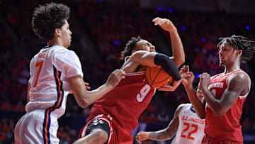 Dec 10, 2024; Champaign, Illinois, USA;  Wisconsin Badgers guard John Tonje (9) pulls down a rebound during the first half against the Illinois Fighting Illini at State Farm Center. Mandatory Credit: Ron Johnson-Imagn Images