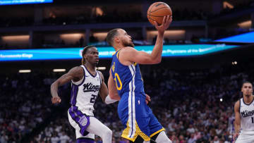 Apr 16, 2024; Sacramento, California, USA; Golden State Warriors guard Stephen Curry (30) shoots against Sacramento Kings guard Keon Ellis (23) in the fourth quarter during a play-in game of the 2024 NBA playoffs at the Golden 1 Center. Mandatory Credit: Cary Edmondson-USA TODAY Sports