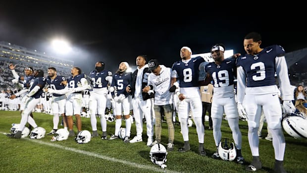  Penn State Nittany Lions players sing their alma mater following a game against the Washington Huskies