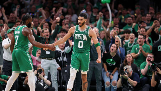 Jun 17, 2024; Boston, Massachusetts, USA; Boston Celtics forward Jayson Tatum (0) celebrates with guard Jaylen Brown (7) after a play against the Dallas Mavericks during the second quarter in game five of the 2024 NBA Finals at TD Garden. Mandatory Credit: Peter Casey-USA TODAY Sports