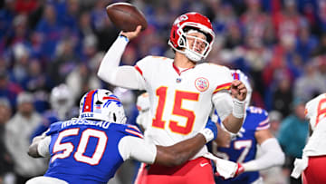 Kansas City Chiefs quarterback Patrick Mahomes (15) is pressured by Buffalo Bills defensive end Greg Rousseau (50) in the second quarter at Highmark Stadium.