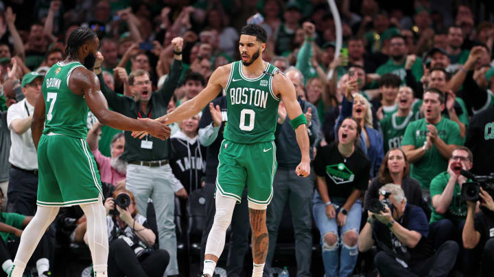 Jun 17, 2024; Boston, Massachusetts, USA; Boston Celtics forward Jayson Tatum (0) celebrates with guard Jaylen Brown (7) after a play against the Dallas Mavericks during the second quarter in game five of the 2024 NBA Finals at TD Garden. Mandatory Credit: Peter Casey-USA TODAY Sports