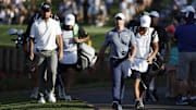 Mar 13, 2025; Ponte Vedra Beach, Florida, USA; Xander Schauffele, left, and Rory Mcllroy walk to the seventeenth green during the first round of The Players Championship golf tournament at TPC Sawgrass. Mandatory Credit: Jeff Swinger-Imagn Images