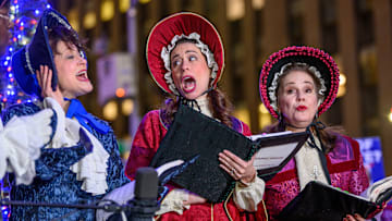 Christmas carolers performing