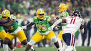 Jan 1, 2024; Glendale, AZ, USA; Oregon Ducks offensive lineman Josh Conerly Jr. (76) against the Liberty Flames