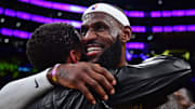 Feb 7, 2023; Los Angeles, California, USA; Los Angeles Lakers forward LeBron James (6) hugs agent Rich Paul after breaking the all-time scoring record in the third quarter against the Oklahoma City Thunder at Crypto.com Arena. Mandatory Credit: Gary A. Vasquez-Imagn Images