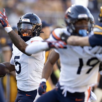Nov 1, 2025; Berkeley, California, USA; Virginia Cavaliers linebacker Kam Robinson (5) runs back a California Golden Bears quarterback Jaron-Keawe Sagapolutele pass for a touchdown during the fourth quarter at California Memorial Stadium. Mandatory Credit: D. Ross Cameron-Imagn Images