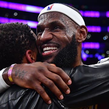 Feb 7, 2023; Los Angeles, California, USA; Los Angeles Lakers forward LeBron James (6) hugs agent Rich Paul after breaking the all-time scoring record in the third quarter against the Oklahoma City Thunder at Crypto.com Arena. Mandatory Credit: Gary A. Vasquez-Imagn Images