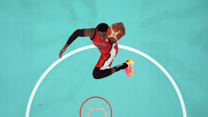 Jul 27, 2024; Villeneuve-d'Ascq, France; Canada small forward Rj Barrett (9) shoots against Greece in the second half during the Paris 2024 Olympic Summer Games at Stade Pierre-Mauroy. Mandatory Credit: John David Mercer-USA TODAY Sports