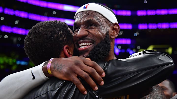 Feb 7, 2023; Los Angeles, California, USA; Los Angeles Lakers forward LeBron James (6) hugs agent Rich Paul after breaking the all-time scoring record in the third quarter against the Oklahoma City Thunder at Crypto.com Arena. Mandatory Credit: Gary A. Vasquez-Imagn Images