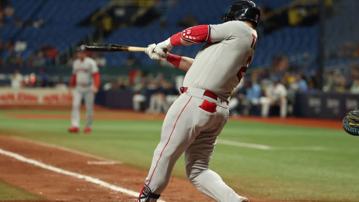 Sep 5, 2023; St. Petersburg, Florida, USA;  Boston Red Sox designated hitter Justin Turner (2) hits a RBI single  against the Tampa Bay Rays during the seventh inning at Tropicana Field. Mandatory Credit: Kim Klement Neitzel-USA TODAY Sports