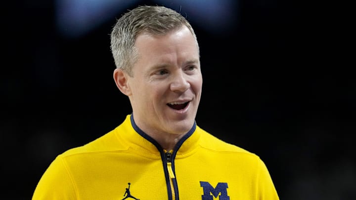 Michigan Wolverines head coach Dusty May talks with his team Monday, April 6, 2026, during the NCAA men's basketball tournament national championship game against the UConn Huskies at Lucas Oil Stadium in Indianapolis.