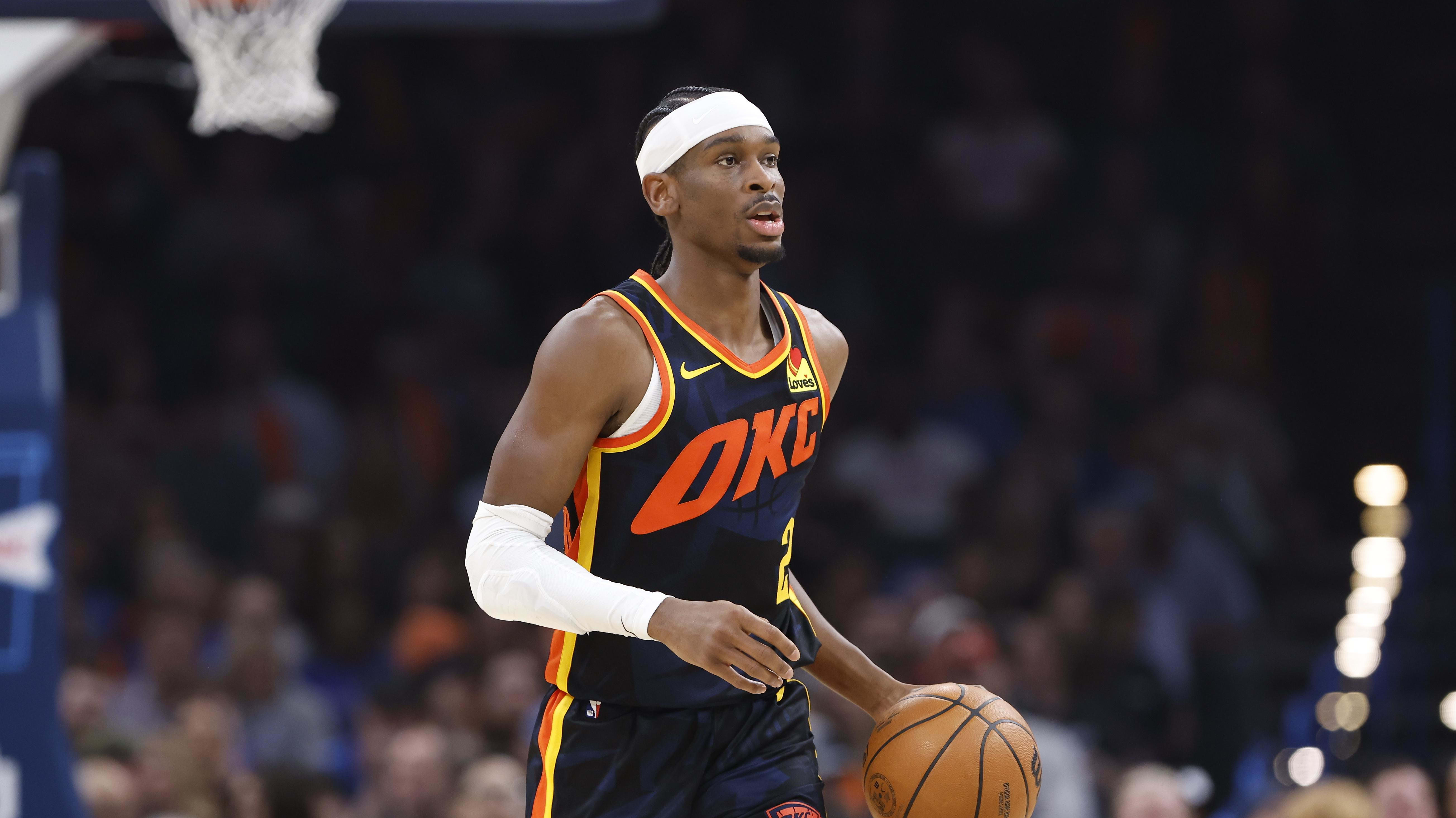 Oklahoma City Thunder guard Shai Gilgeous-Alexander dribbles the basketball up the court.