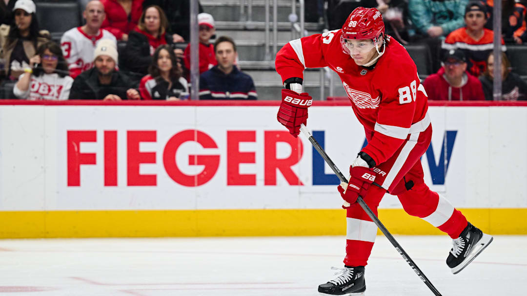 Apr 4, 2025; Detroit, Michigan, USA; Detroit Red Wings right wing Patrick Kane (88) shoots and scores a goal during the second period against the Carolina Hurricanes at Little Caesars Arena. Mandatory Credit: Tim Fuller-Imagn Images