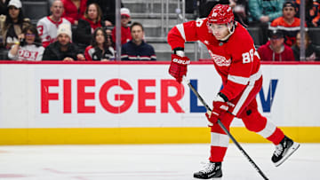 Apr 4, 2025; Detroit, Michigan, USA; Detroit Red Wings right wing Patrick Kane (88) shoots and scores a goal during the second period against the Carolina Hurricanes at Little Caesars Arena. Mandatory Credit: Tim Fuller-Imagn Images