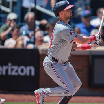 Jul 11, 2024; New York City, New York, USA; Washington Nationals right fielder Lane Thomas (28) singles during the first inning against the New York Mets at Citi Field.