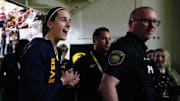 Indiana Fever guard Caitlin Clark walks back into the tunnel after the Fever defeated Brazil in a WNBA preseason game.