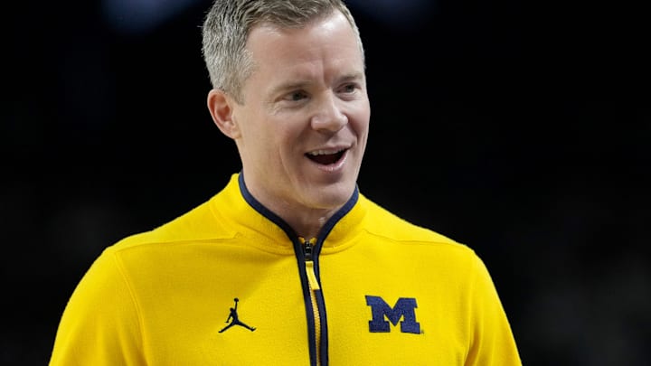 Michigan Wolverines head coach Dusty May talks with his team Monday, April 6, 2026, during the NCAA men's basketball tournament national championship game against the UConn Huskies at Lucas Oil Stadium in Indianapolis.