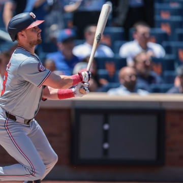 Jul 11, 2024; New York City, New York, USA; Washington Nationals right fielder Lane Thomas (28) singles during the first inning against the New York Mets at Citi Field. Mandatory Credit: Vincent Carchietta-USA TODAY Sports