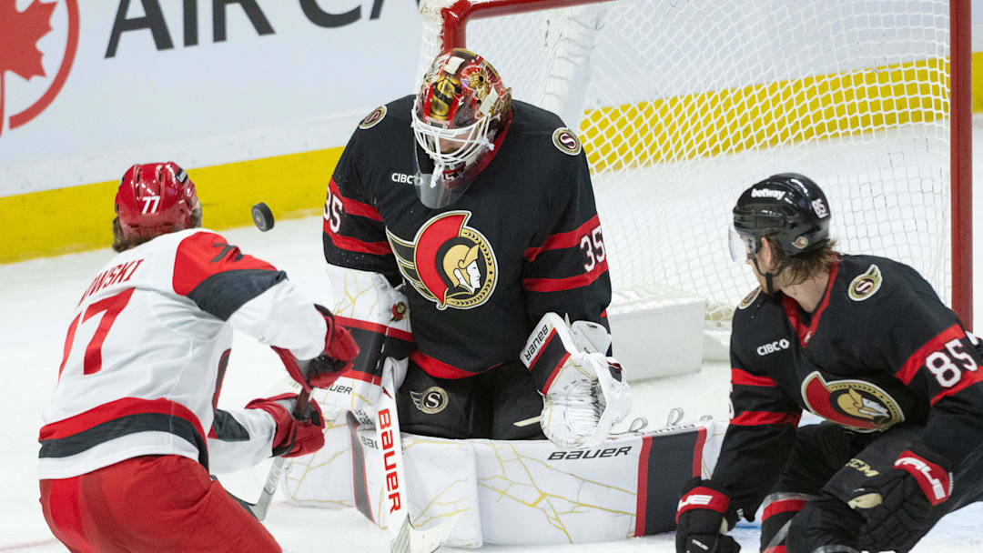 Apr 5, 2026; Ottawa, Ontario, CAN; Ottawa Senators goalie Linus Ullmark (35) makes a save on a shot from Carolina Hurricanes left wing Mark Jankowski (77) in the third period at the Canadian Tire Centre. Mandatory Credit: Marc DesRosiers-IMAGN Images