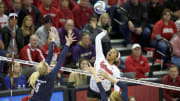 Dec 9, 2016; Lincoln, NE, USA;  Nebraska Cornhuskers Briana Holman (13) spikes the ball against Penn State Nittany Lions Ali Frantti (5) and Tori Morrell (11) at Bob Devaney Sports Center.