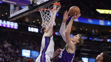 Oct 25, 2023; Salt Lake City, Utah, USA;  Utah Jazz forward Lauri Markkanen (23) is fouled while shooting by Sacramento Kings forward Domantas Sabonis (10) during the second half at Delta Center. Mandatory Credit: Chris Nicoll-USA TODAY Sports